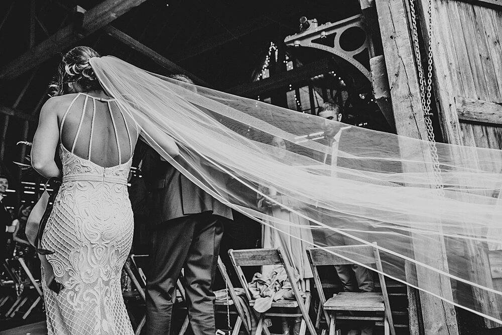 Autumn reds at The Barns at Lodge Farm with pet doggies, Irish folk music, cheesecake & budgie smugglers. Bride wears Rosa Clara & Valentino. Essex Documentary Wedding Photographer