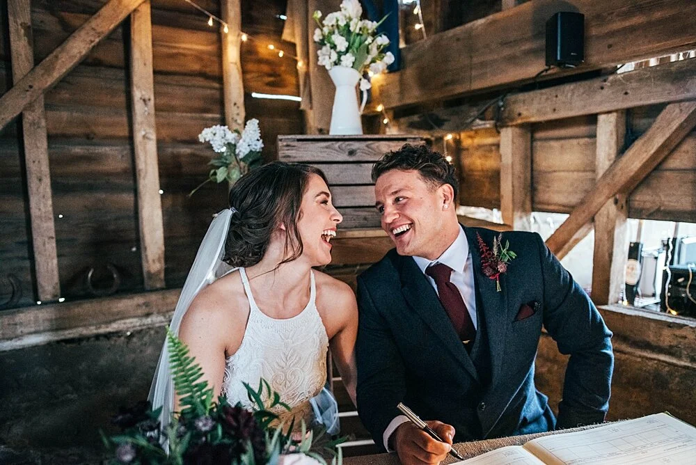 Autumn reds at The Barns at Lodge Farm with pet doggies, Irish folk music, cheesecake & budgie smugglers. Bride wears Rosa Clara & Valentino. Essex Documentary Wedding Photographer