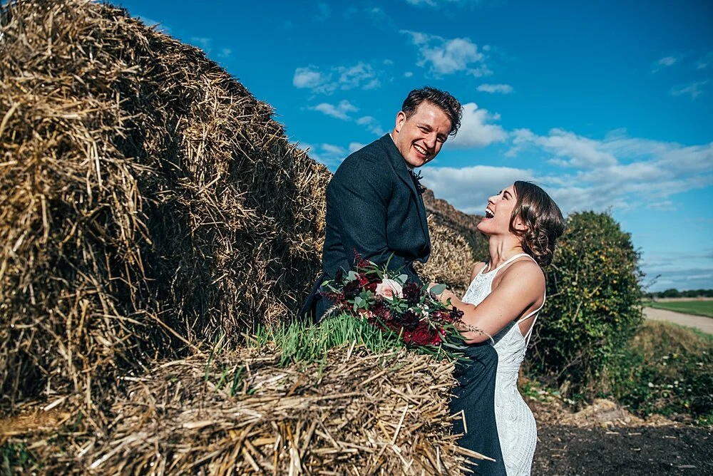 Autumn reds at The Barns at Lodge Farm with pet doggies, Irish folk music, cheesecake & budgie smugglers. Bride wears Rosa Clara & Valentino. Essex Documentary Wedding Photographer