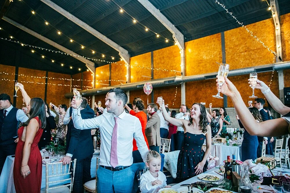 Autumn reds at The Barns at Lodge Farm with pet doggies, Irish folk music, cheesecake & budgie smugglers. Bride wears Rosa Clara & Valentino. Essex Documentary Wedding Photographer