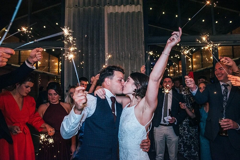Autumn reds at The Barns at Lodge Farm with pet doggies, Irish folk music, cheesecake & budgie smugglers. Bride wears Rosa Clara & Valentino. Essex Documentary Wedding Photographer