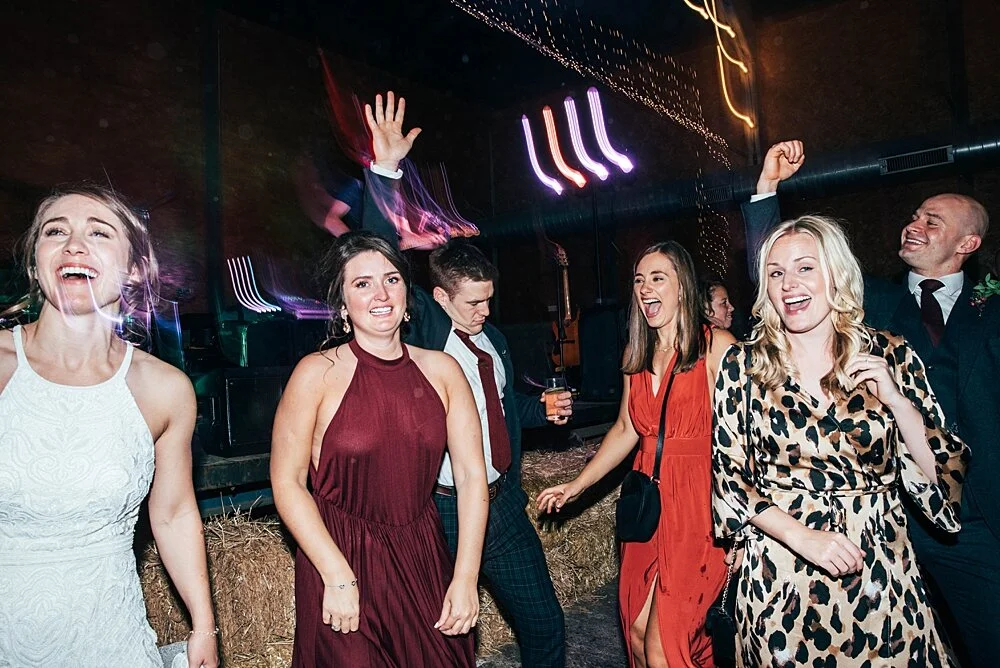 Autumn reds at The Barns at Lodge Farm with pet doggies, Irish folk music, cheesecake & budgie smugglers. Bride wears Rosa Clara & Valentino. Essex Documentary Wedding Photographer