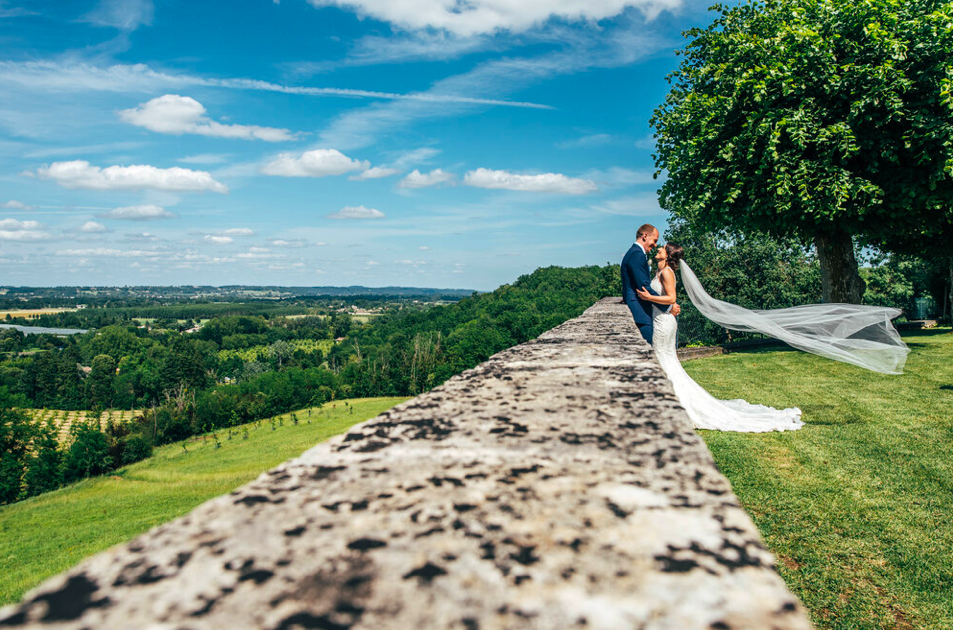 Bride &amp; Groom with view of The Dordogne Chateau Soulac Essex documentary wedding photographer
