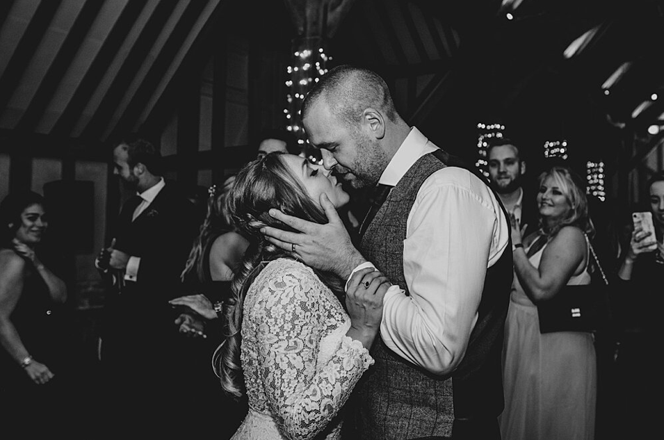 Groom kisses Bride on dance floor at Blake Hall Essex top best documentary wedding photographer 