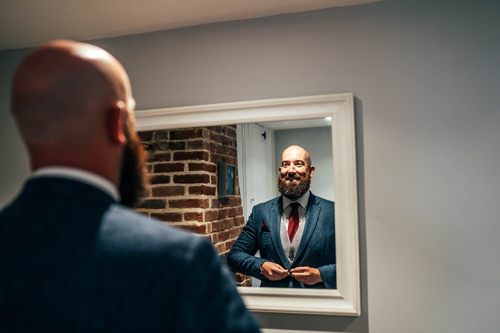 A luxe barn wedding with opulent reds, a Hollywood bridal vibe and fantastic beards at Copdock Hall. Essex Documentary wedding photographer. Suffolk Wedding Photographer