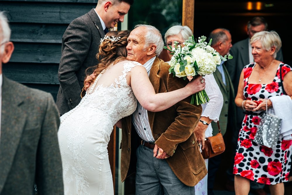 Tweed, Emerald Green &amp; Dinosaur corsages for a lush Autumn wedding at The White Hart, Great Yeldham. Essex Documentary Wedding Photographer