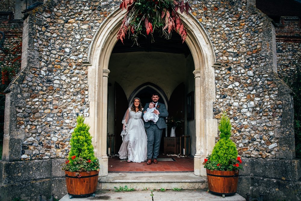 Wild, Autumn statement wedding at Tuffon Hall with Bridesmaids in coppers and greens and flower girls in Hunter wellington boots. Essex documentary wedding photographer