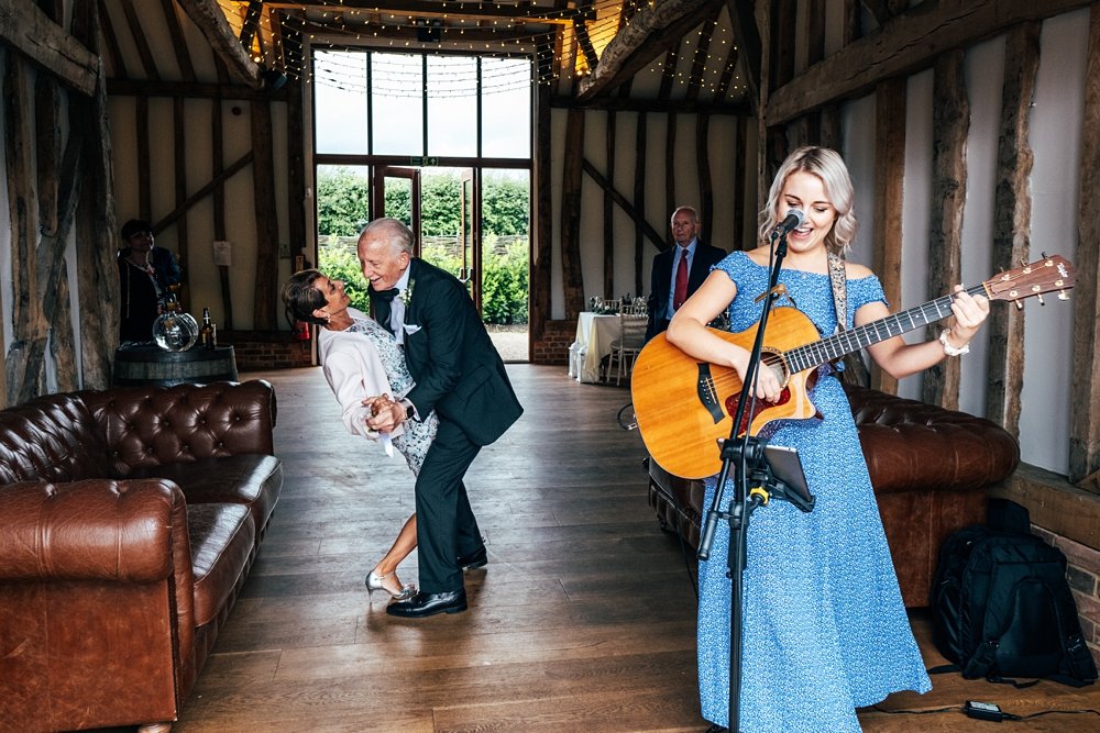 An elegant black tie Spring wedding at Villiers Barn with a palette of greens &amp; whites. Essex documentary wedding photographer
