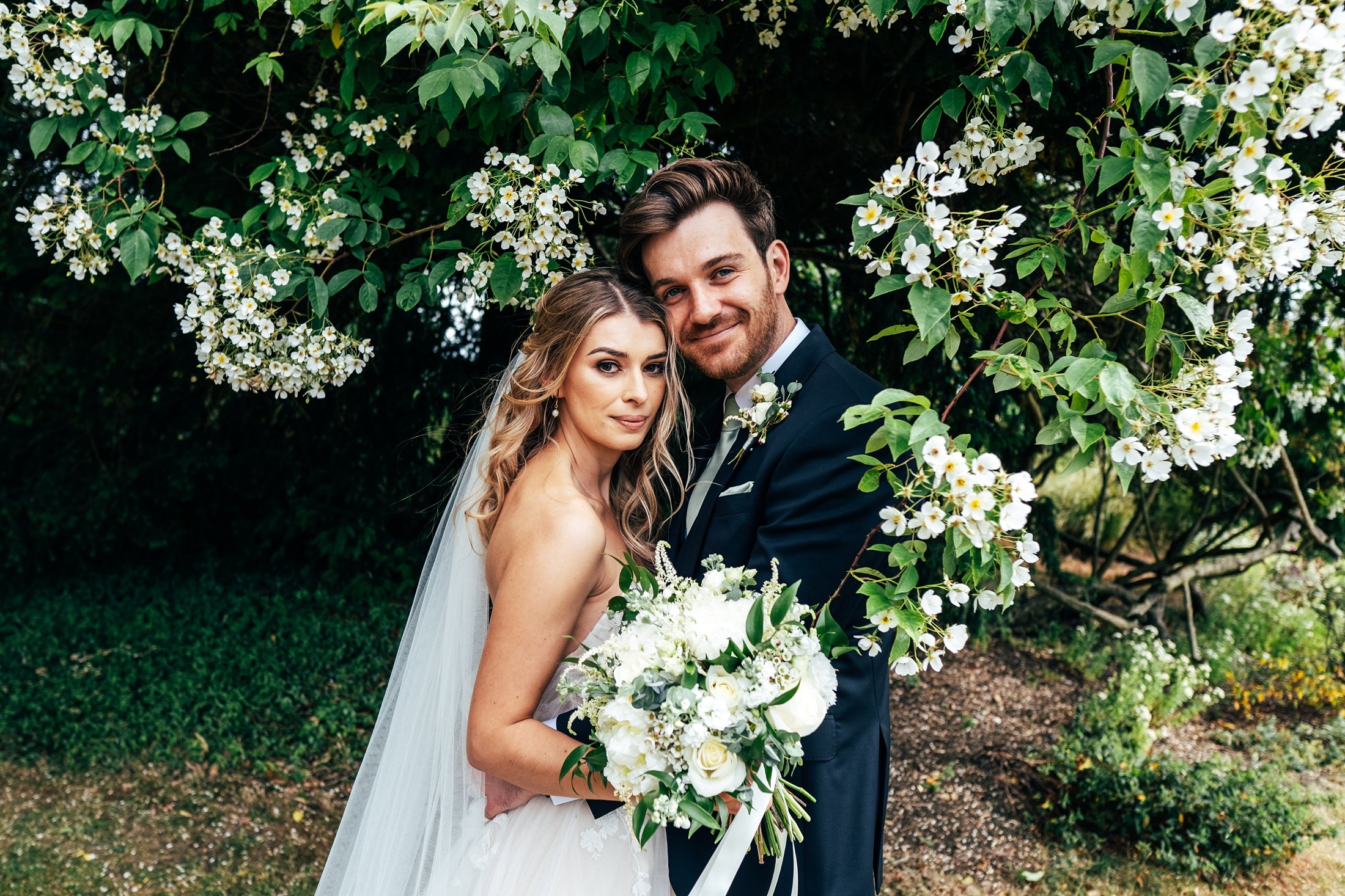 A perfect mid-summer wedding at blake hall with a palette of muted greesn and neutrals. Bride showcases two willowby by watters dresses.        essex documentary wedding photographer