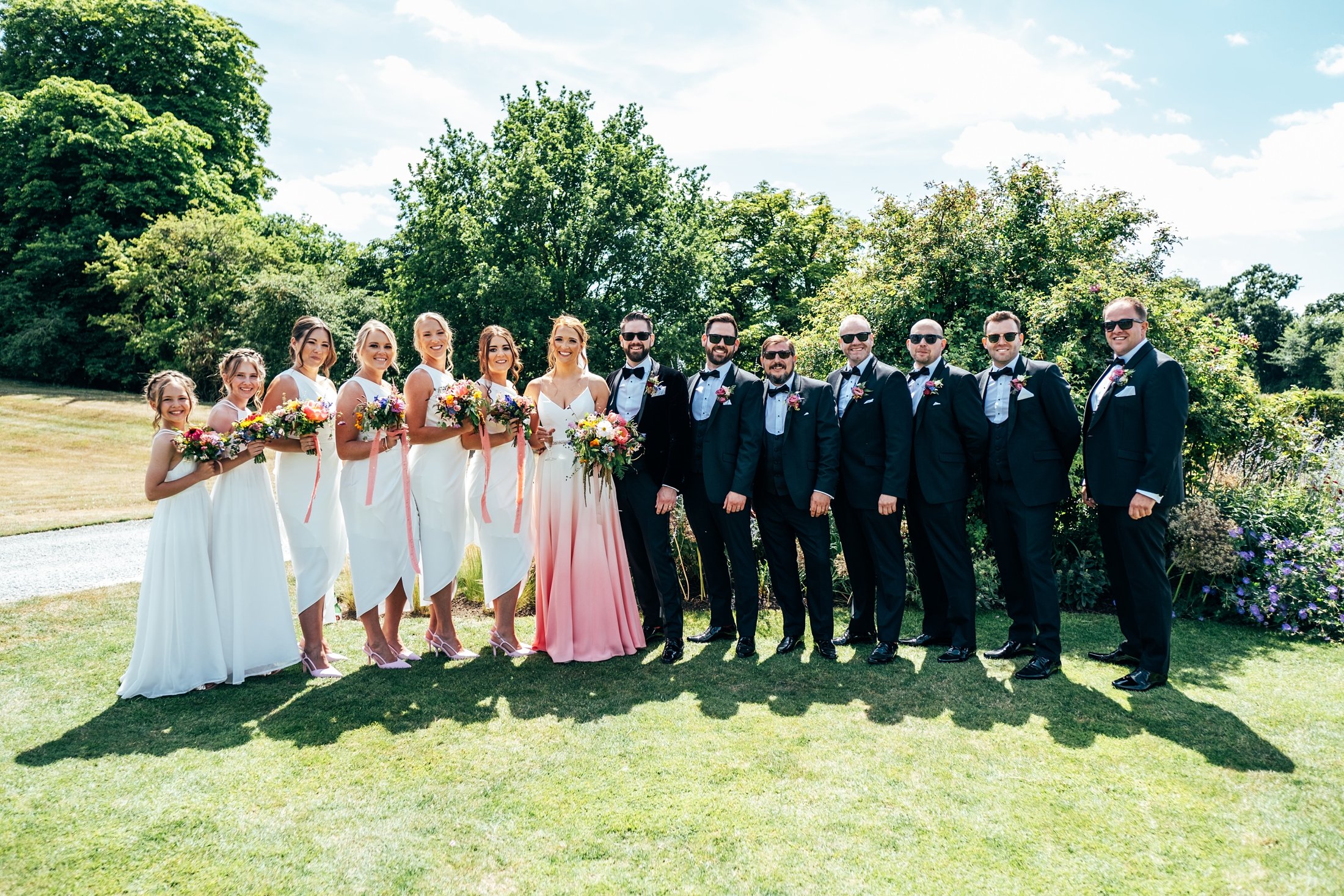 Black tie with pink dip dye wedding dress bridesmaids in white crazy golf lawn dancing summer Bruisyard Country Estate Wedding Essex Suffolk documentary wedding photographer