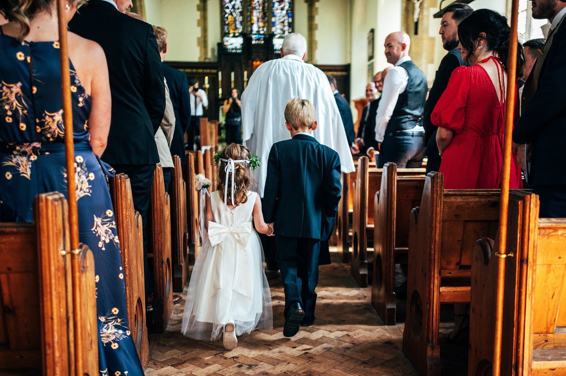 Pretty pastels &amp; cornflower blues for a late Summer church ceremony &amp; wedding at Villiers Barn. Essex documentary wedding photographer.
