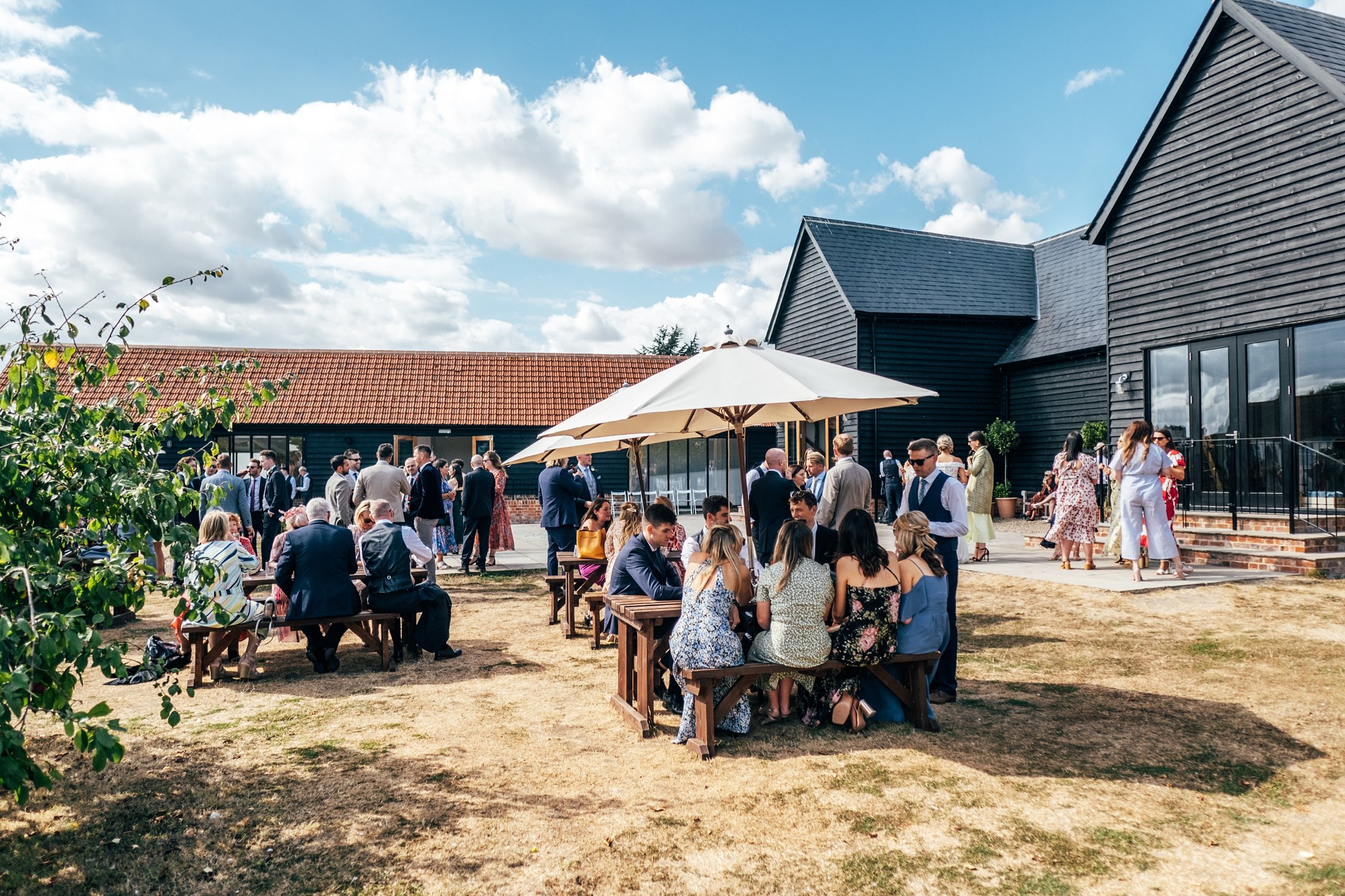 Pretty pastels &amp; cornflower blues for a late Summer church ceremony &amp; wedding at Villiers Barn. Essex documentary wedding photographer.