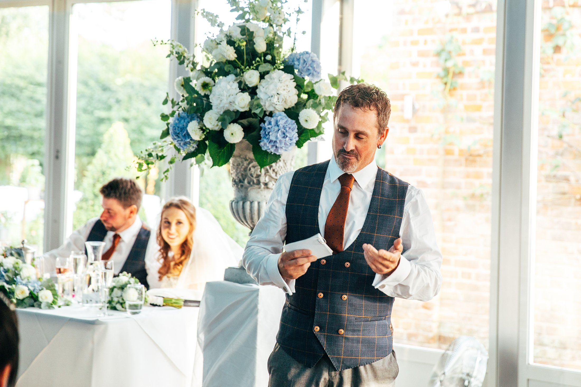 Late summer sunset, Blues &amp; Whites, doggy guest of honour, a pantomime dame and epic dance routines for this Braxted Park wedding. Essex documentary wedding photographer