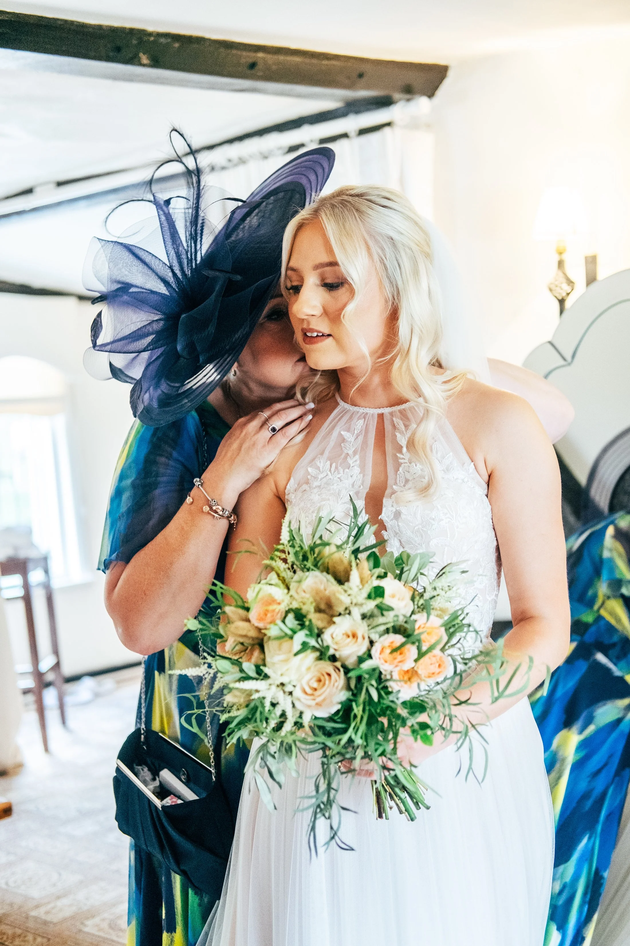 Delicate sage &amp; white paired with black tie for an early Autumn barn wedding at The White Hart, Great Yeldham. Essex documentary wedding photographer
