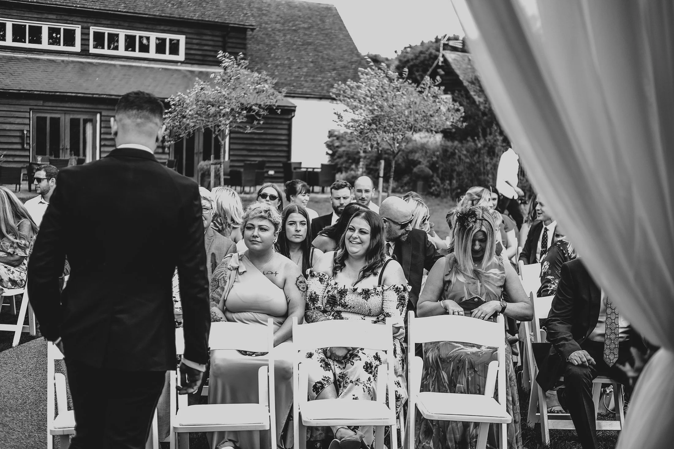 Delicate sage &amp; white paired with black tie for an early Autumn barn wedding at The White Hart, Great Yeldham. Essex documentary wedding photographer