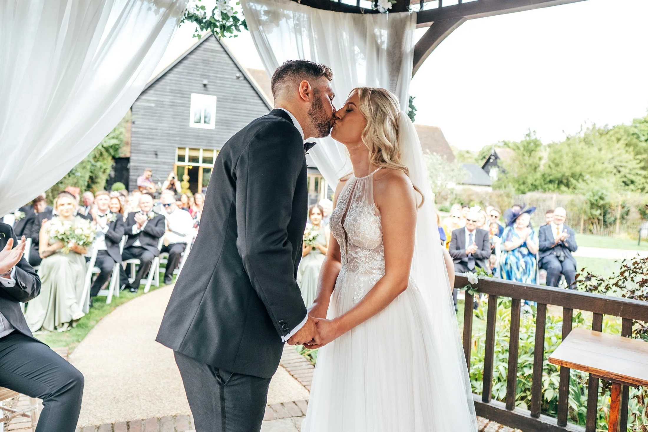 Delicate sage &amp; white paired with black tie for an early Autumn barn wedding at The White Hart, Great Yeldham. Essex documentary wedding photographer