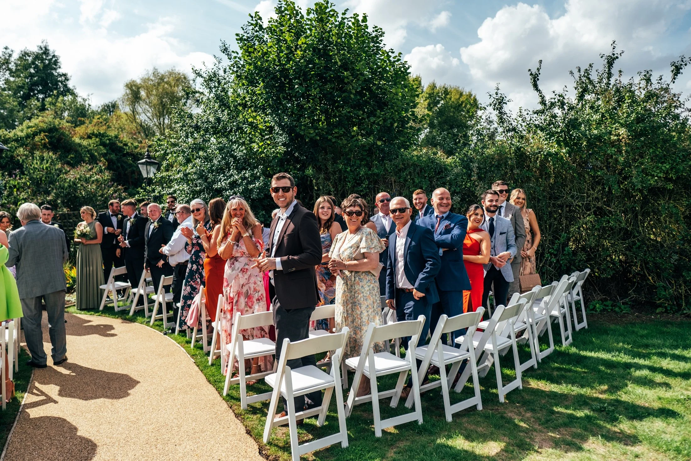 Delicate sage &amp; white paired with black tie for an early Autumn barn wedding at The White Hart, Great Yeldham. Essex documentary wedding photographer