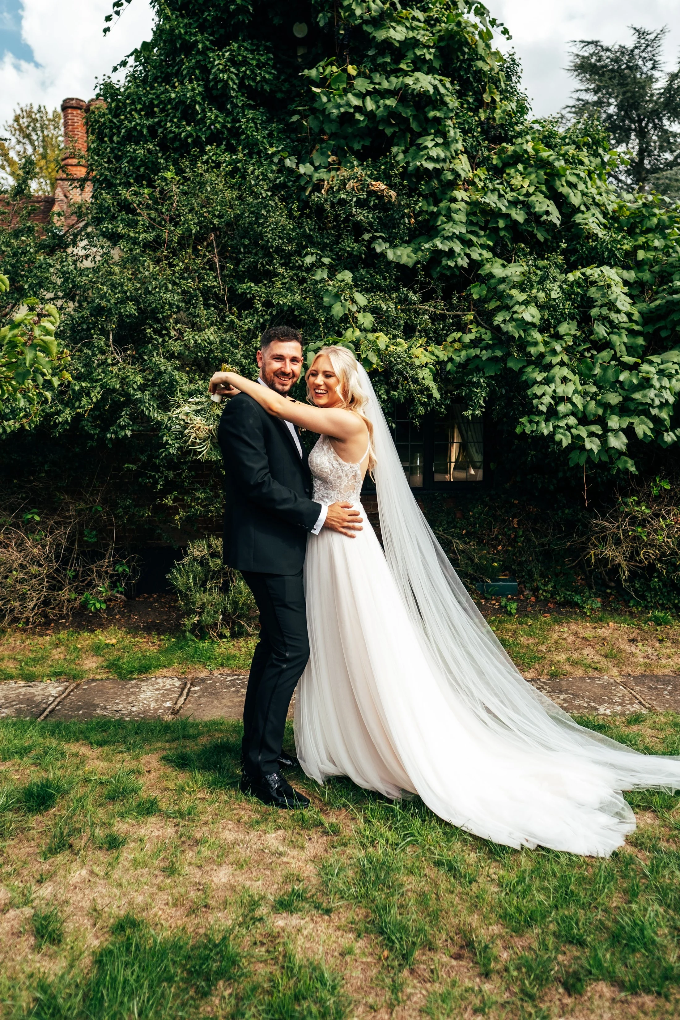 Delicate sage &amp; white paired with black tie for an early Autumn barn wedding at The White Hart, Great Yeldham. Essex documentary wedding photographer