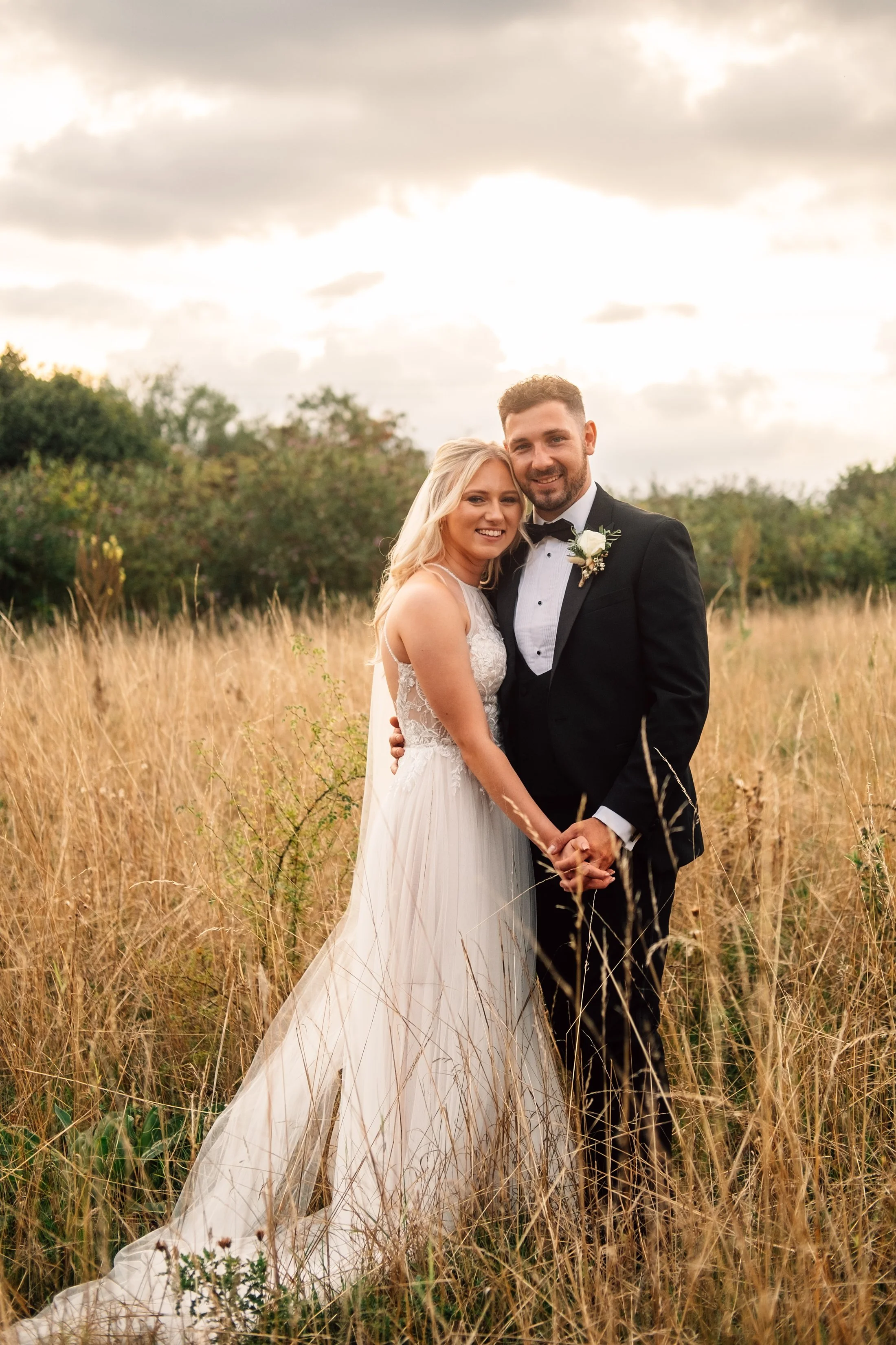 Delicate sage &amp; white paired with black tie for an early Autumn barn wedding at The White Hart, Great Yeldham. Essex documentary wedding photographer
