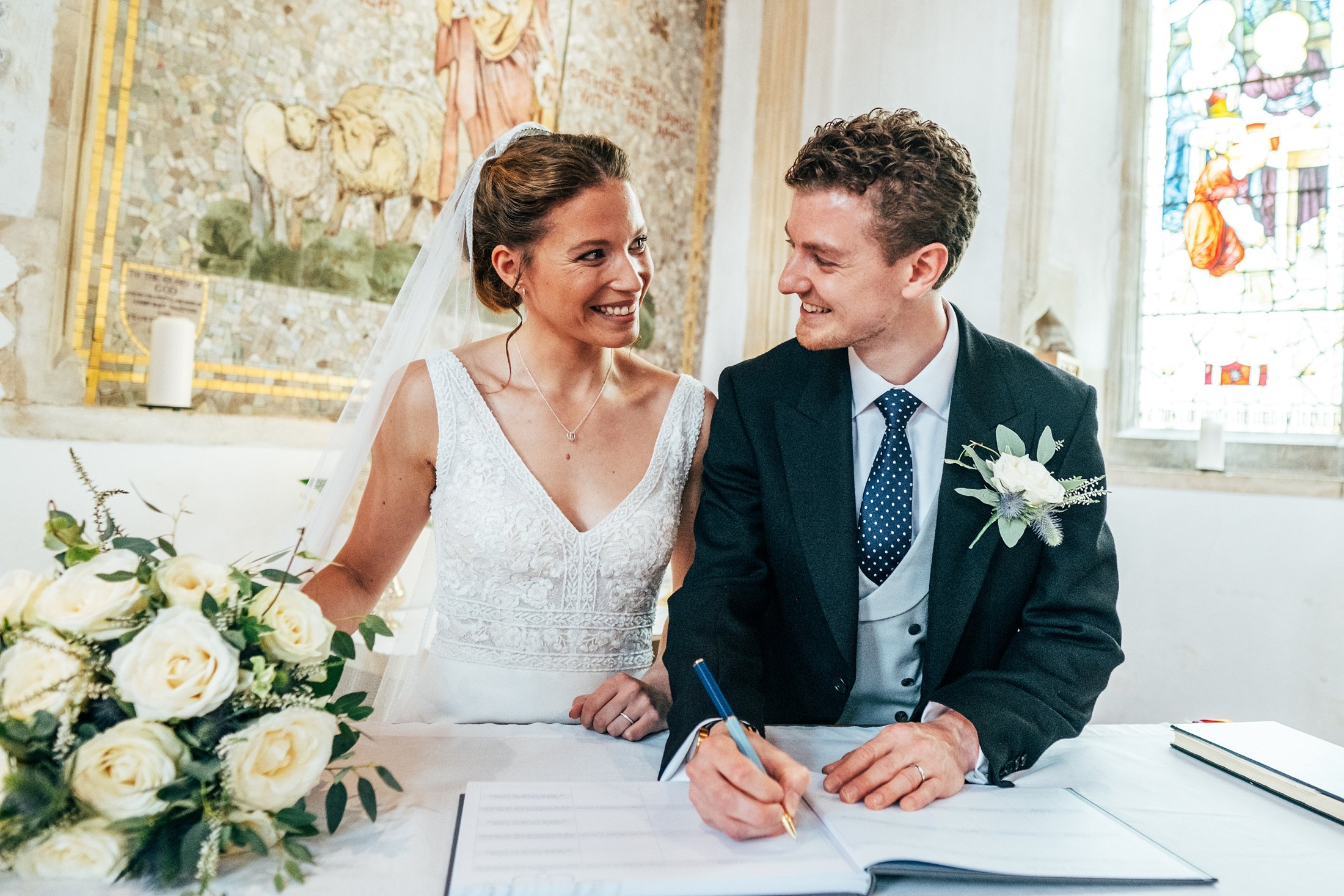 Blues &amp; thistles for a travel inspired autumn church &amp; vineyard wedding at Tuffon Hall. Essex documentary wedding photographer
