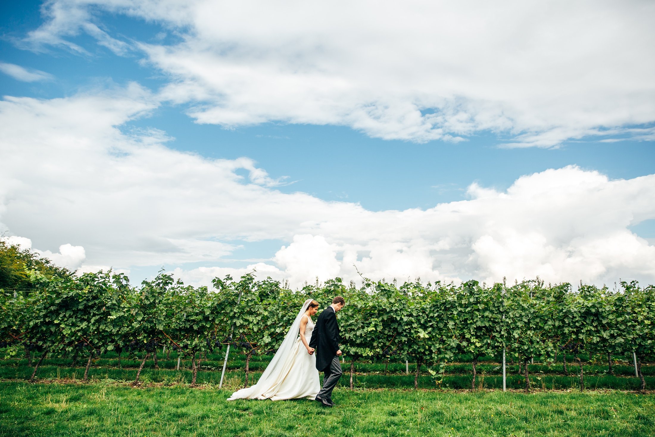 Blues &amp; thistles for a travel inspired autumn church &amp; vineyard wedding at Tuffon Hall. Essex documentary wedding photographer