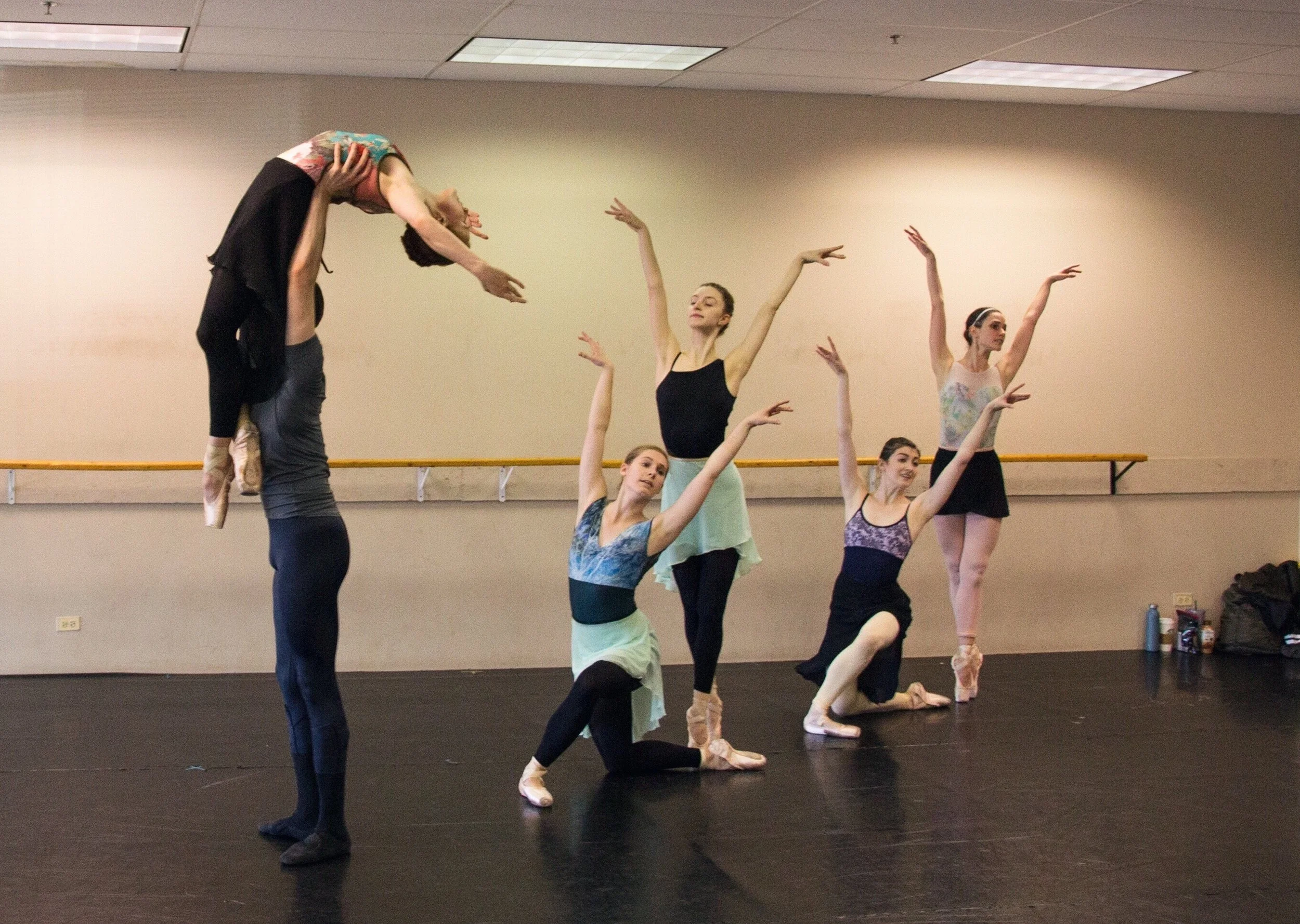 Laura Peterman (Center, kneeling) with artists of the company rehearsing Shades of Refrain .