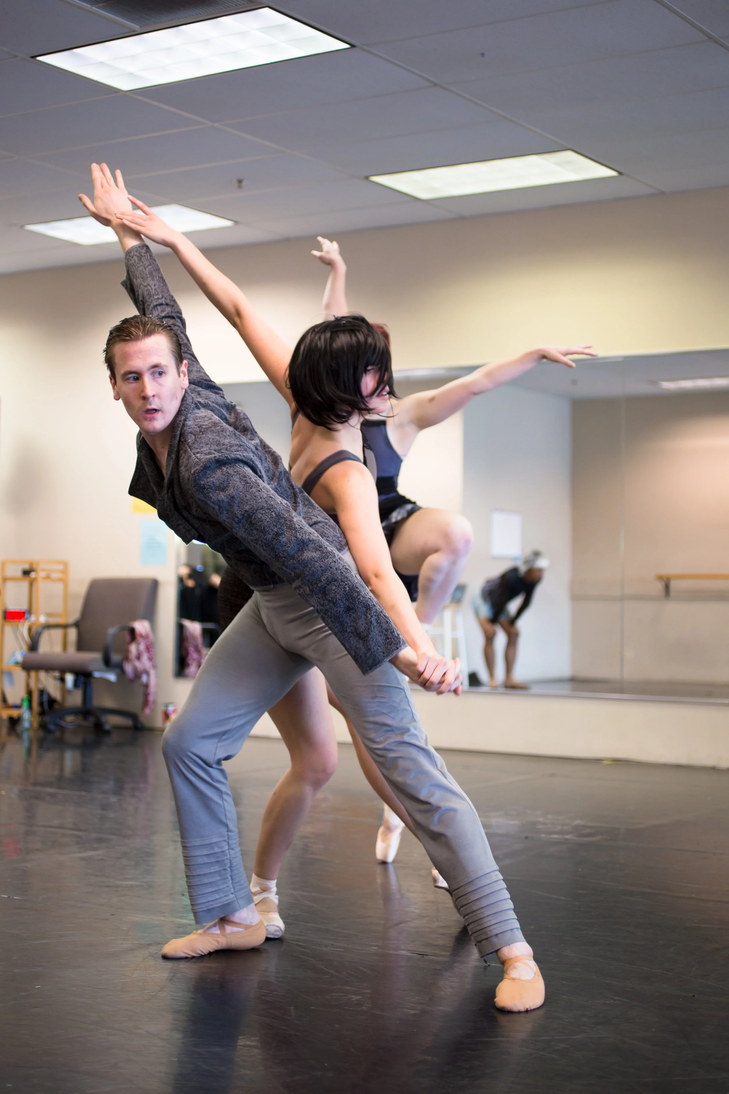 Company Artist Sam Opsal in rehearsal for the Grey Town movement from The Space in Between .