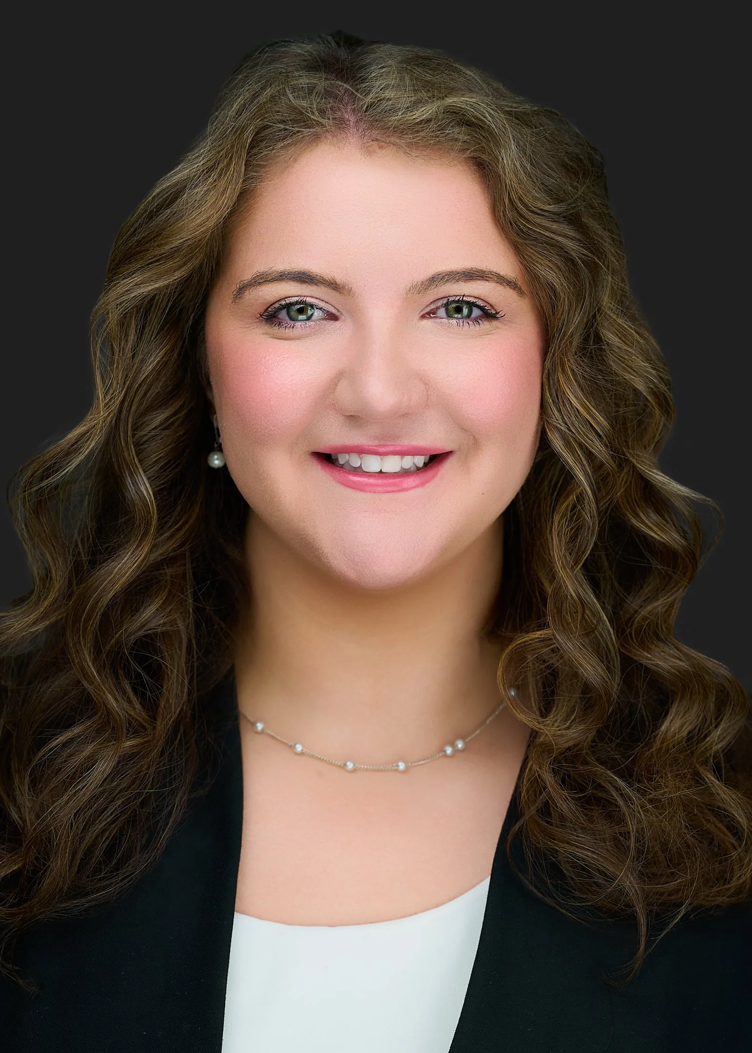 Professional headshot of a Tallahassee Electronic Residency Application Service (ERAS) applicant in a white blouse and black jacket by Robert Hunter Photography