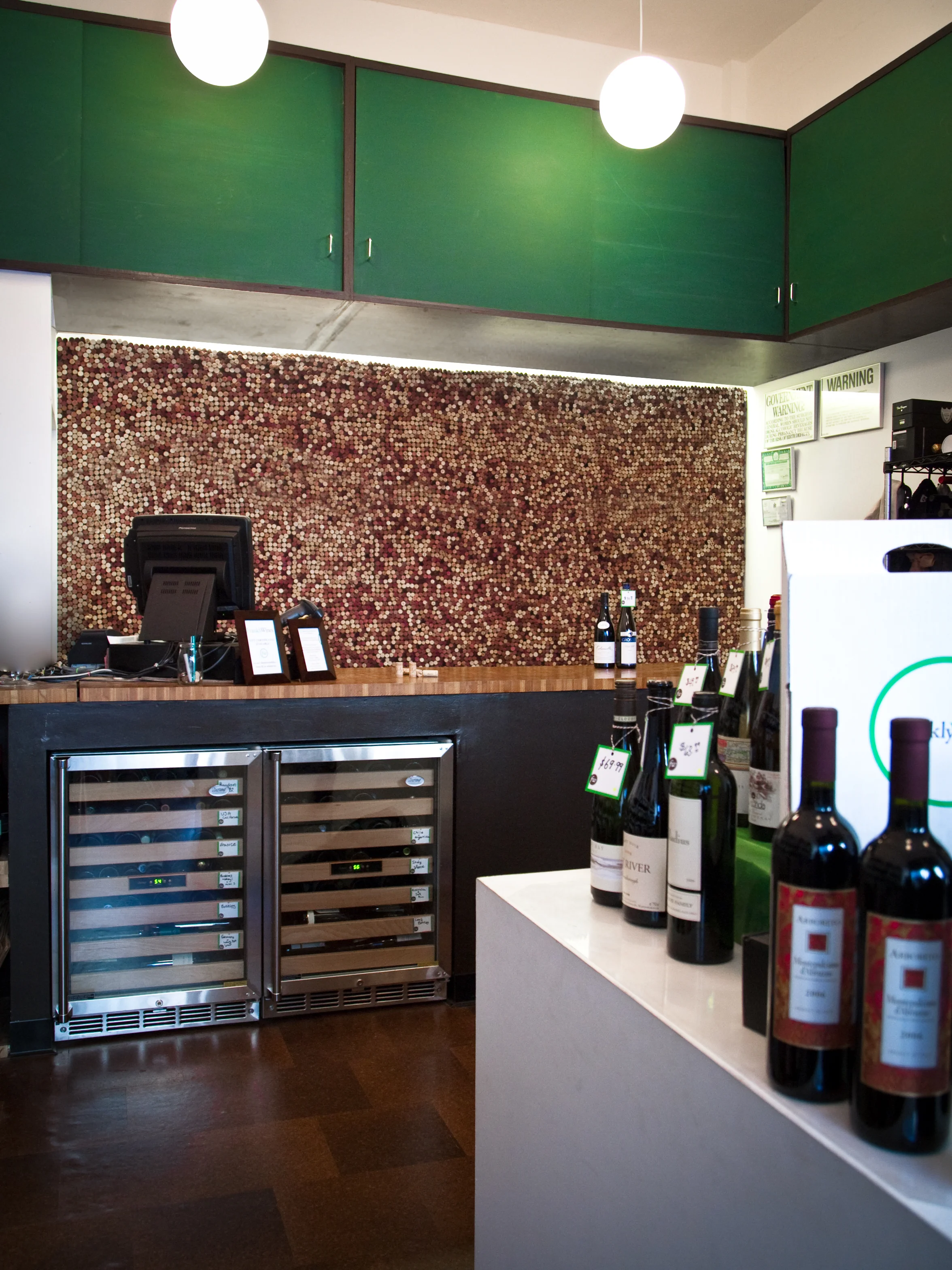 Frankly Wines is a wine merchant in Manhattan's TriBeCa neighborhood. The design centers on the various uses of cork - cork floors and the thousands of reused corks used to cover up the back wall. franklywines.com