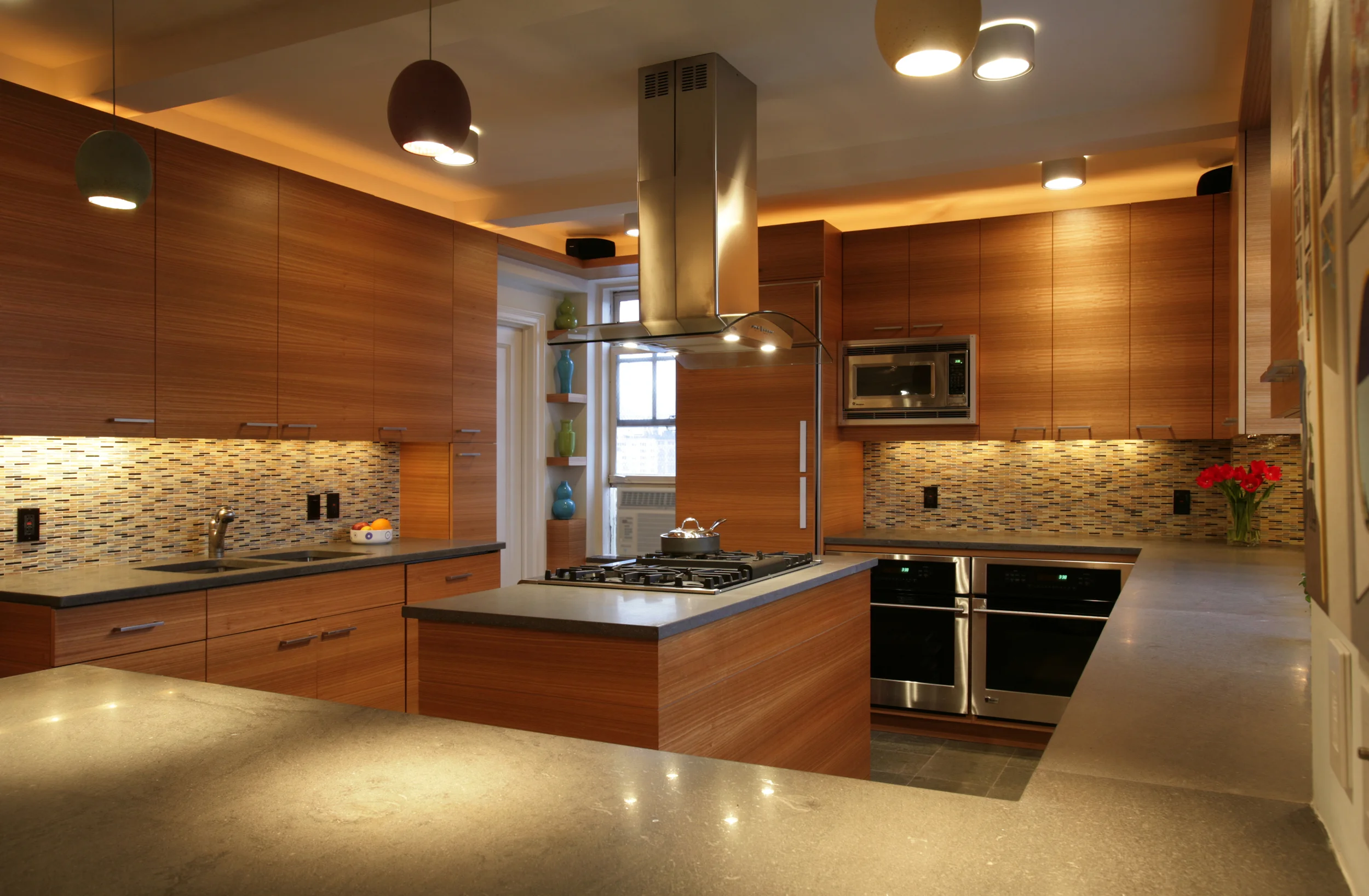 The R Residence is a 2400 sf, 3 bedroom, 3 bathroom, full gut renovation in New York City's Greenwich Village. As the owner is an artist, the design was developed to allow for maximum natural light, and wall hanging space for artwork. The apartment features a 1000 bottle wine cellar and fully integrated electronic and sound systems. The materials used throughout the project are rich and expressive.