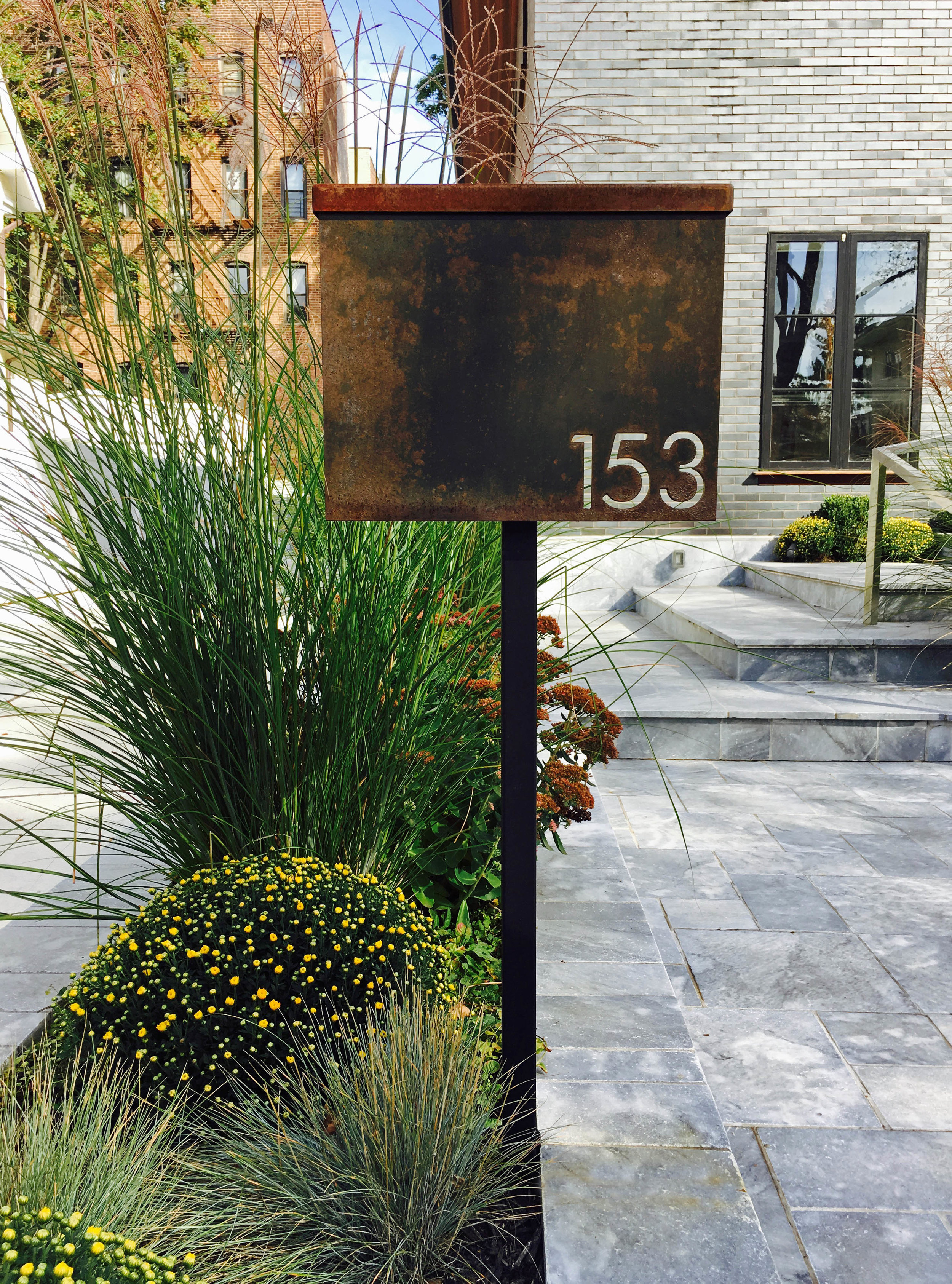 House 153 is a residence in Brooklyn's Bay Ridge neighborhood. The project was a complete transformation of an existing house. The entire house was rebuilt save for foundations, roof structure, and bits and pieces of walls. The exterior material was changed to brick, and the interiors and landscaping were altered significantly to suit the needs of the inhabitants- a family with young children.