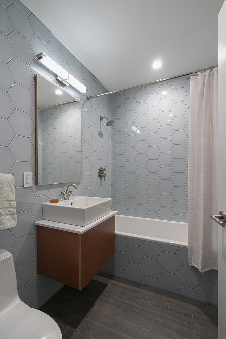 This was once a powder room, but with a complete re-orientation, a new tub was added to create a full second bathroom.