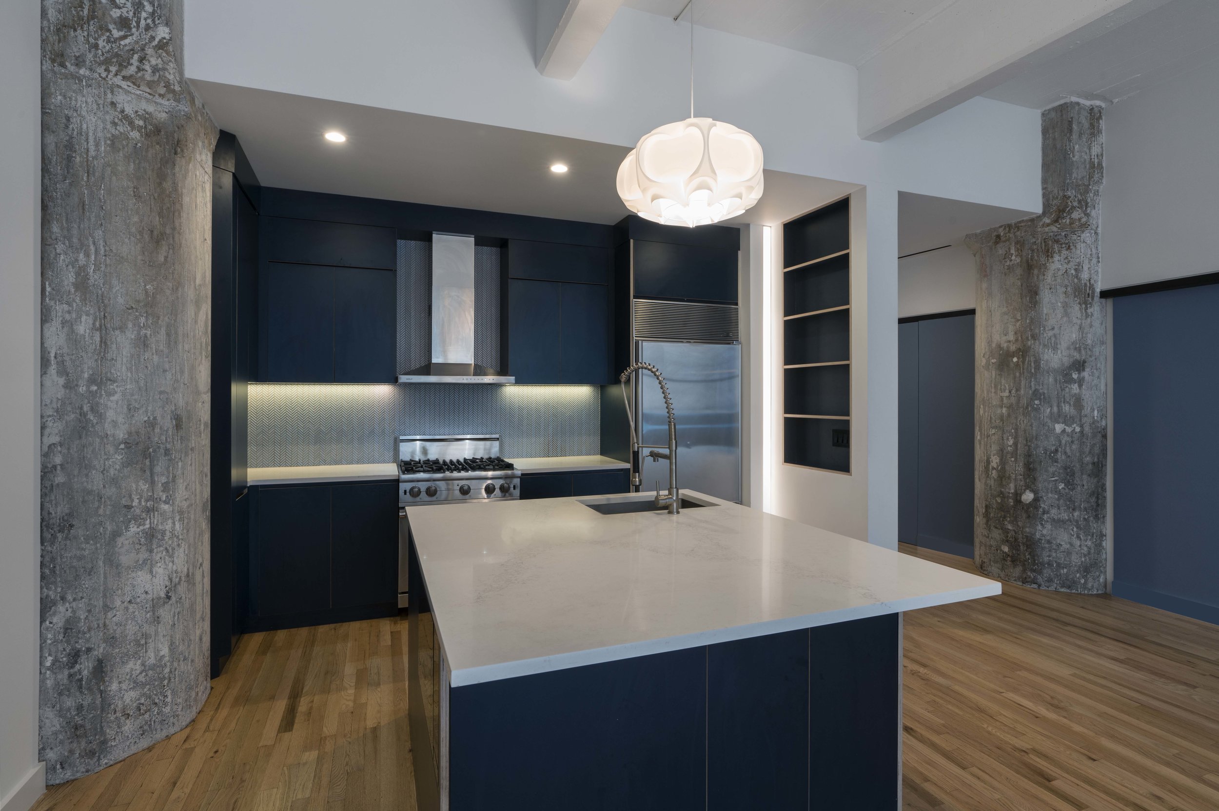 1 Main St. is an apartment renovation in DUMBO Brooklyn. The home has amazing bridge views, the design was geared toward amplifying the openness and utility of the space; a new bathroom was created where once there was only a powder room, closets were expanded and tucked away in the angles of the walls, and old finishes were replaced with new.