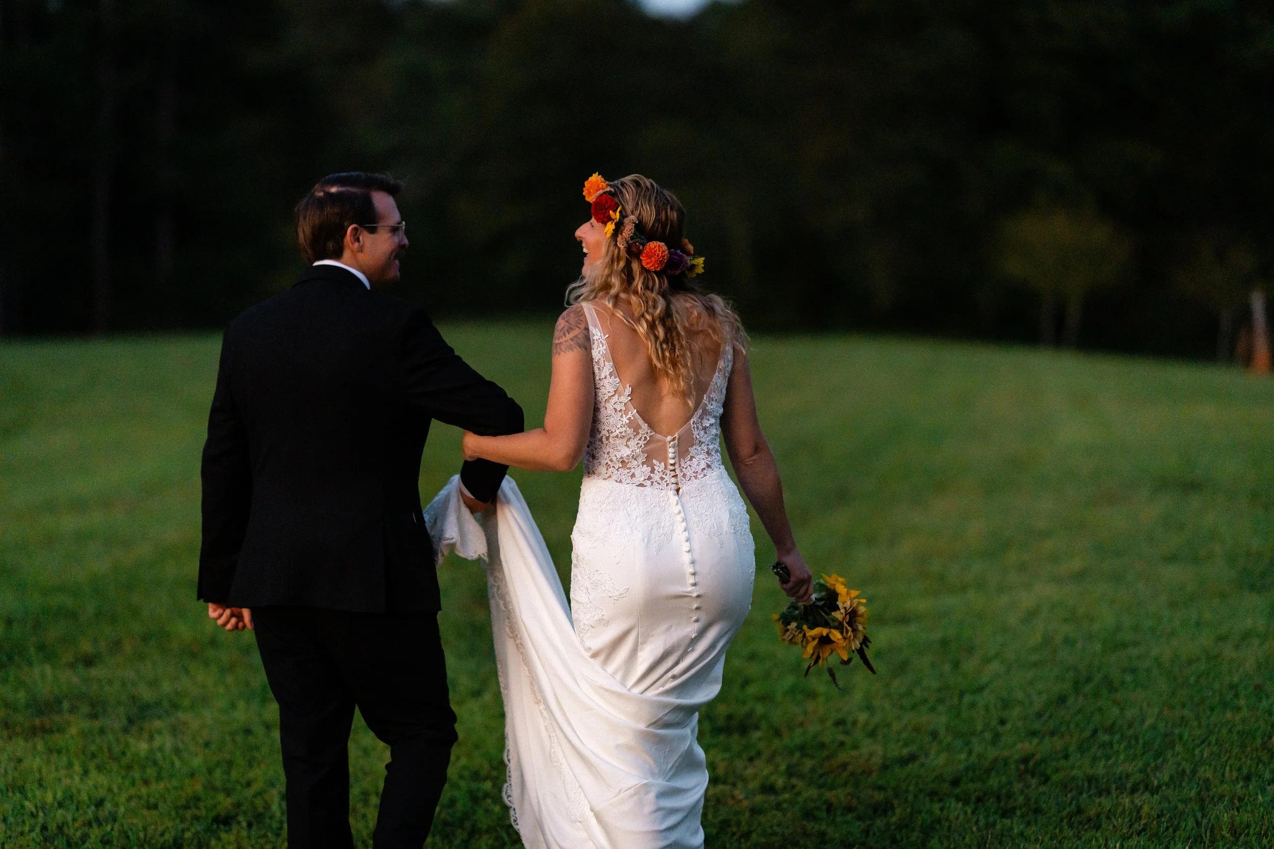 Newlyweds walking together during their post-Helene Asheville wedding.