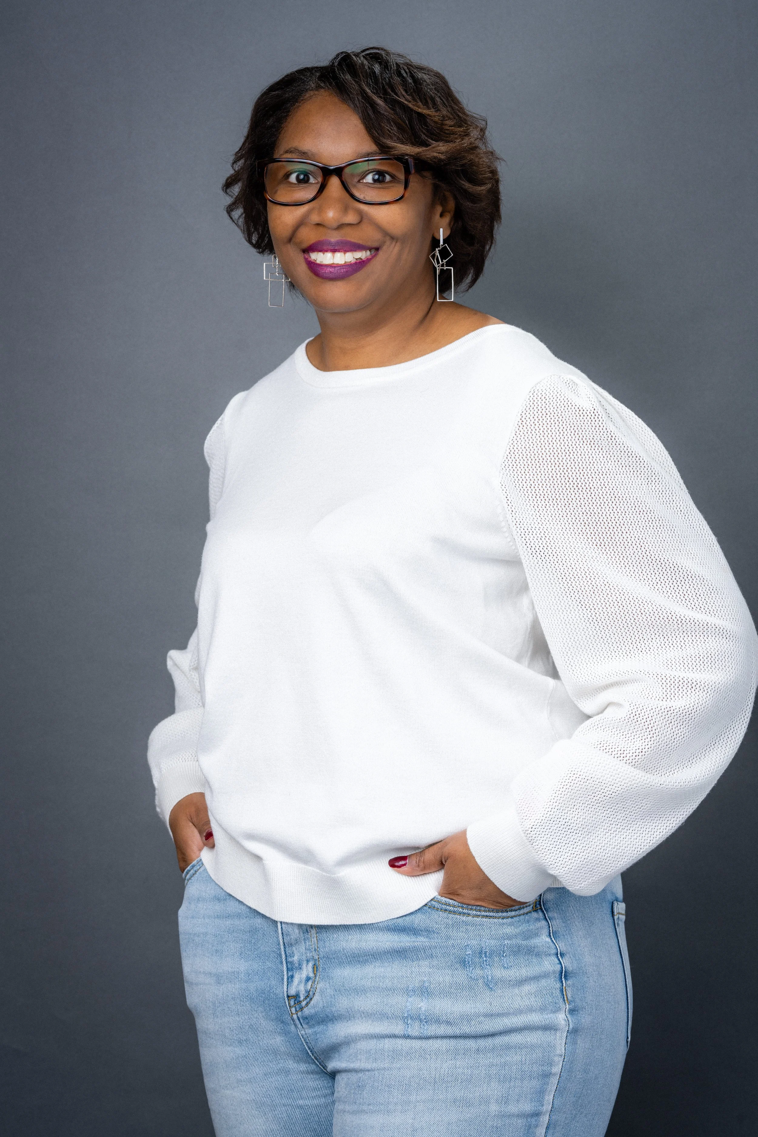 Professional headshot of an Asheville entrepreneur in a modern office setting, captured by an Asheville branding photographer.