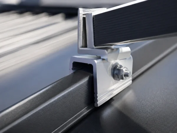 Non-penetrating seam clamp attaching a solar rail to a standing seam metal roof