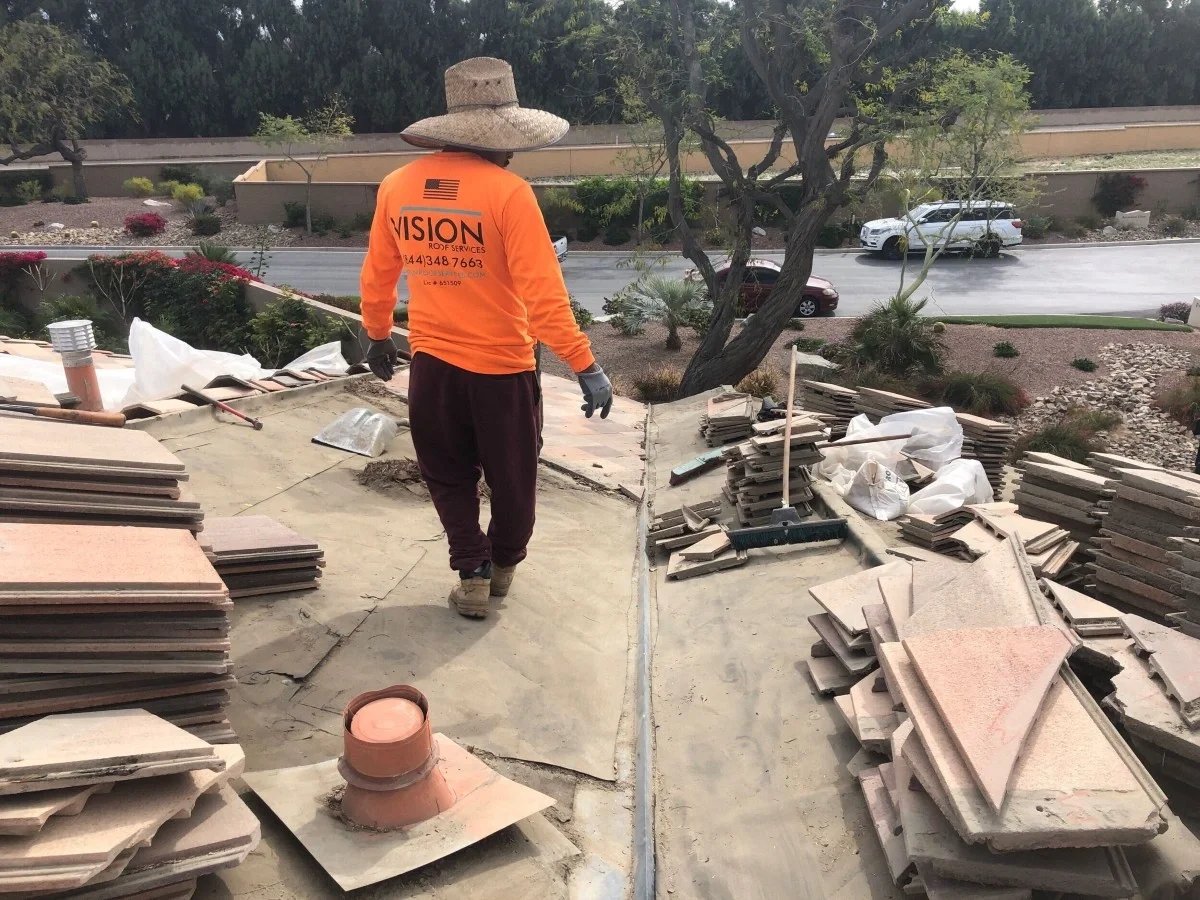 Roofer working on roof replacement