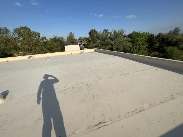 Completed white flat roofing system with clean membrane surface
