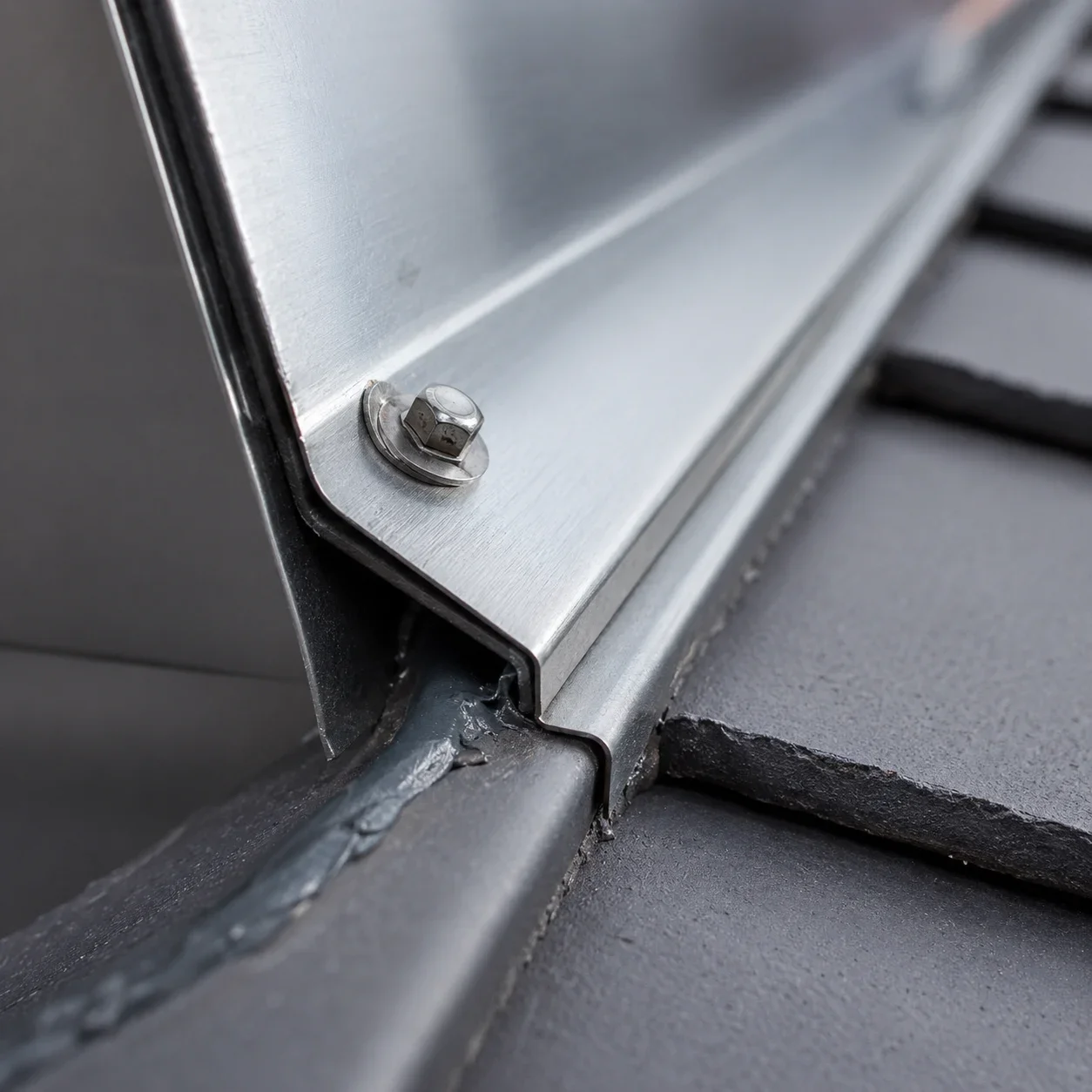 Stainless steel roofing fastener and flashing detail for coastal salt air