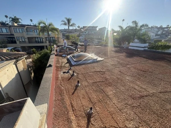 Flat roof prepared for commercial roofing restoration and repairs.