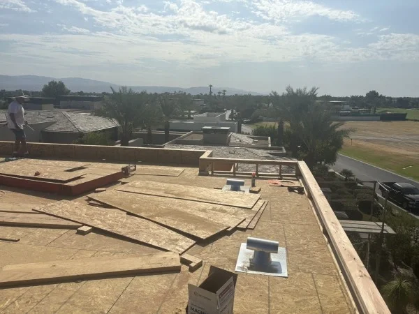 New roof decking installed before residential roofing system installation.
