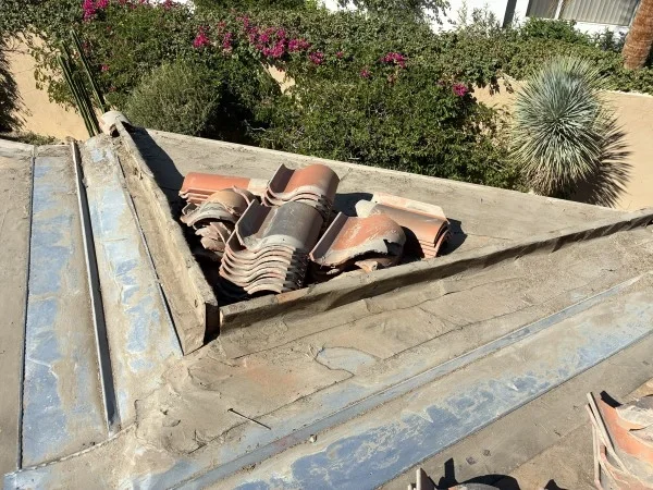 Concrete roof tiles stacked during roof replacement preparation process