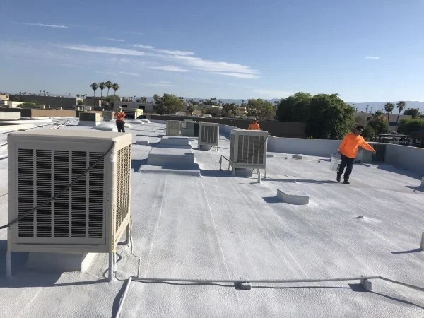 Commercial flat roof coated with reflective white roofing system