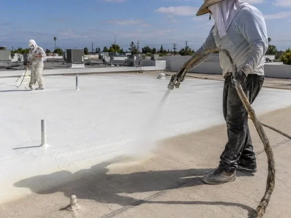 Spray polyurethane foam applied over an existing commercial roof