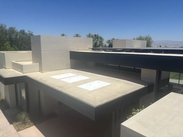 Modern flat roof prepared for rooftop solar panel installation.