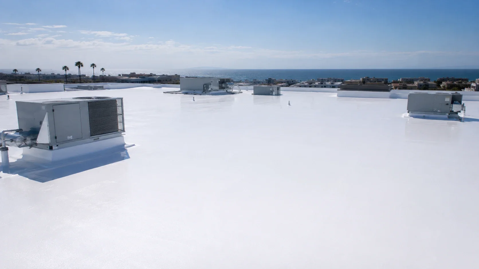 Reflective spray foam roof on a commercial building near the Huntington Beach coast