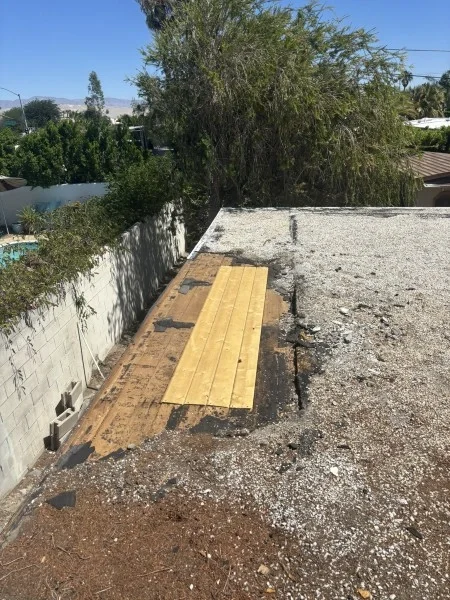 Flat roof edge opened during structural roof repair project.