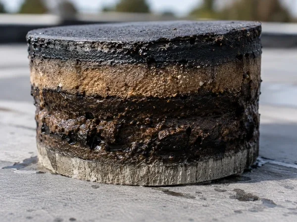 Wet insulation core sample showing a roof past coating repair