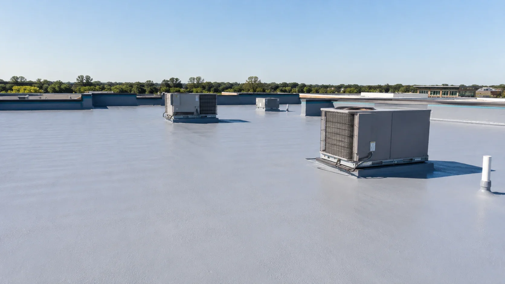 Commercial spray foam flat roof system on an Orange, CA building
