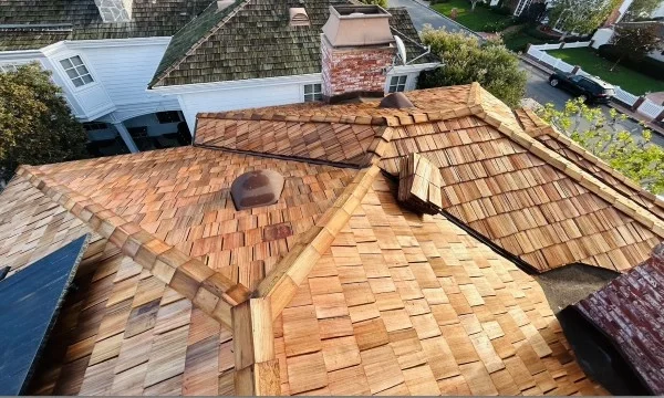 Newly installed cedar shake roof with premium wood shingles.
